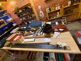 a table with a bunch of different types of skis on it