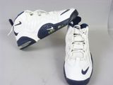 pair of white and blue sneakers with black soles on a white surface