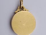 an image of a gold locke with a bird on top of it