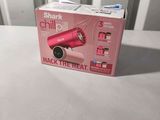 a box with a pink hair dryer on a table