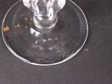 a glass of wine sitting on top of a table