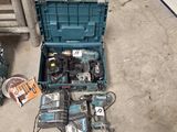 a blue tool box with tools in it on the floor