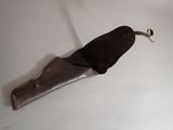 a knife that is laying on a white table