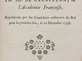 an old book with a black and white image of a cat sitting on top of it