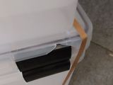 a close up of a plastic box with a handle on it