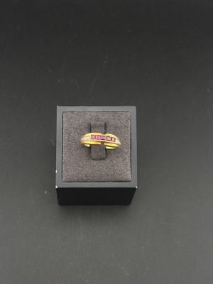 a close up of a ring in a box on a table