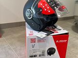 a helmet sitting on top of a box on the floor