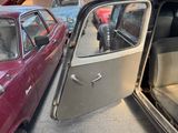 a red car with its door open and a red car with its door open