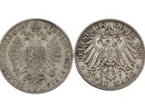 une pièce d'argent sur laquelle figure un aigle à deux têtes