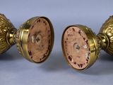 pair of antique brass candlesticks with red and black marbles