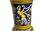 a blue vase with a yellow and blue design on it