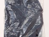 a plastic bag with a black hat inside of it