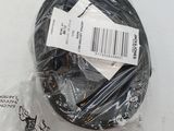 a black cable that is wrapped in plastic on a table