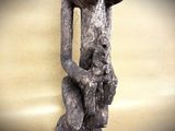 a statue of a man holding a baby in his arms