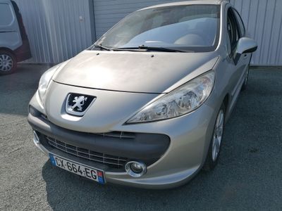a silver car parked in front of a building