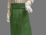 an image of a mannequin wearing a green skirt and a white blouse