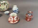 many different types of vases and bowls on the table