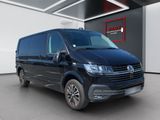 a black volkswagen california van parked in a showroom