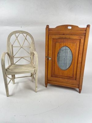 two miniature chairs and a cabinet on a white background