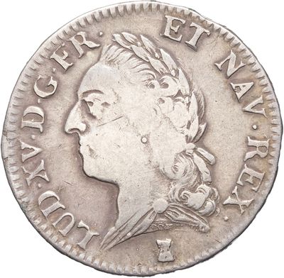 gros plan d'une pièce de monnaie sur laquelle figure une tête de femme