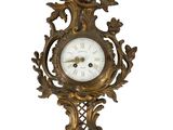 an image of a gold clock with a white face on a white background