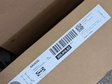 a box with a barcode on it sitting on the ground