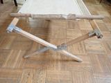 a small folding table with a white cloth on it