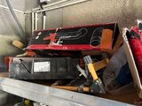 a shelf full of tools and other items in a garage