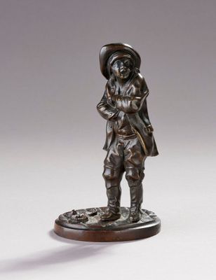 une statue en bronze représentant un homme coiffé d'un chapeau et accompagné d'un chien