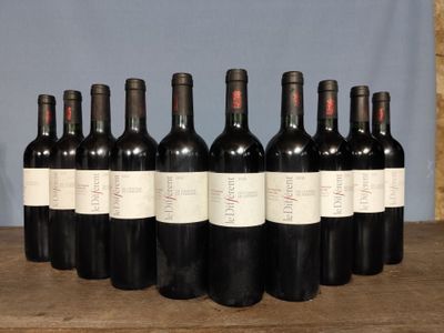 six bottles of wine are lined up on a wooden table