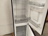 an open refrigerator that is sitting in a room