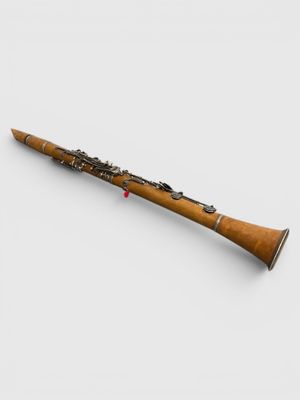 a close up of a bassoon on a white surface
