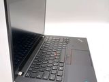 a laptop with a black keyboard on a white surface