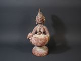 an image of a statue of a woman holding a bowl