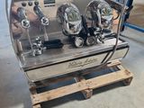 an image of a coffee machine sitting on top of a wooden pallet