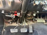 a close up of a car ' s pedals and brake pedals