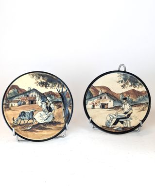 pair of vintage hand painted plates with asian scenes on them