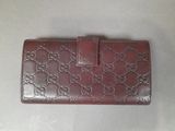 brown guccissi wallet purse with red trimming