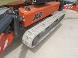 an image of a tractor with a crane attached to it ' s back