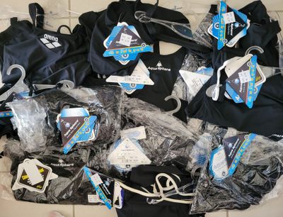 a lot of clothes that are on the floor