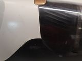 a close up of a white and black blender on a counter