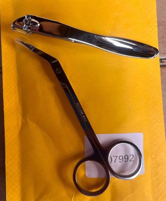 a pair of scissors and a pair of scissors on a piece of paper