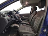 the interior of a blue car with black seats and a steering wheel