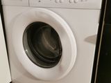 a washer and a dryer in a small kitchen