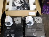 two boxes of electronic equipment sitting on the floor