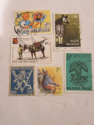 four different stamps on a piece of paper on a table