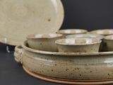 several bowls and plates are stacked on top of each other on a table