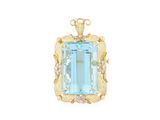 a close up of a blue topaz stone pendant on a white background