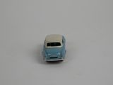 a small toy car that is sitting on a white surface