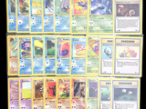 a lot of pokemon cards that are on the table